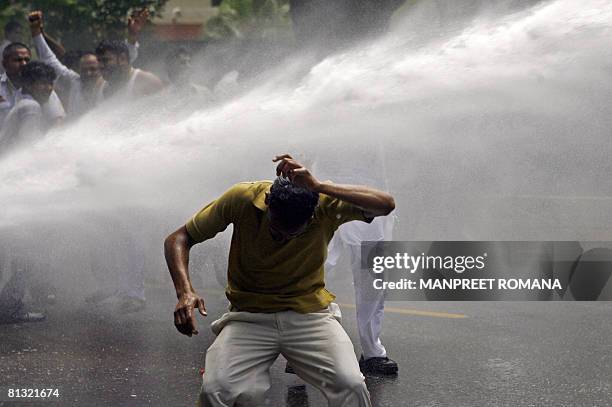 Indian police use a water canon to disperse Gujjar protesters during a protest in New Delhi on June 1, 2008. Agreeing to the demand of the Gujjars,...