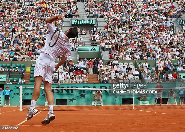 French player Michael Llodra serves to Latvian player Ernests Gulbis during their French tennis Open fourth round match at Roland Garros, on June 01,...