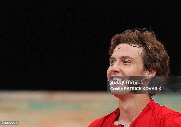 Latvian player Ernests Gulbis reacts after winning against French player Michael Llodra during their French tennis Open fourth round match at Roland...