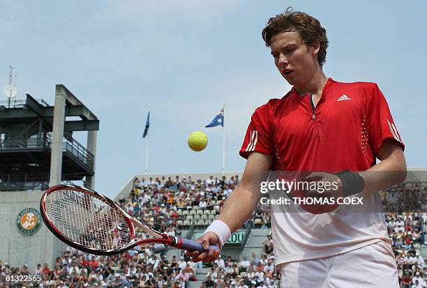 Latvian player Ernests Gulbis gets ready to serve to French player Michael Llodra during their French tennis Open fourth round match at Roland...