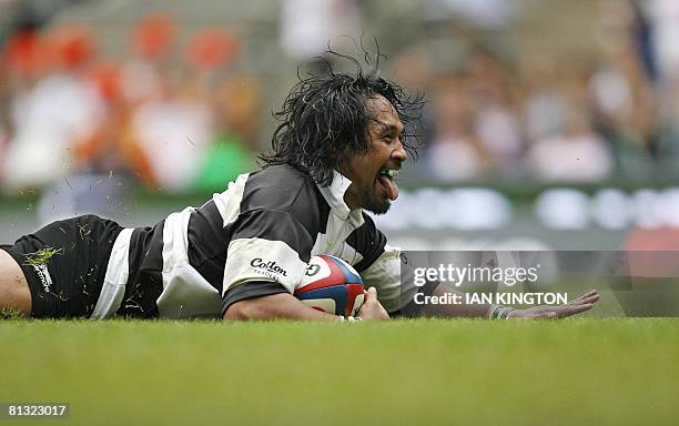 Barbarian's Samoan player Seilala Mapusua scores a try between the posts during the Gartmore Challenge Rugby Union international match against...