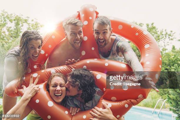 friends during a summer day - inflatable swimming pool stock pictures, royalty-free photos & images