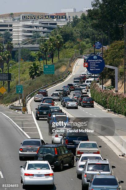 Traffic lines up for miles on the 101 freeway and the offramp to Universal Studios theme park amid reports that the park will open even as hundreds...