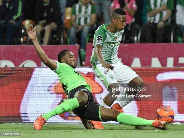 Andres Ibarguen of Atletico Nacional vies for the ball with Nilson Castrillon of Deportivo Cali during the Final second leg match between Atletico...
