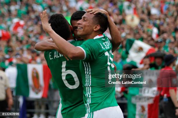 Elias Hernandez of Mexico celebrates with teammates after scoring the second goal for his team during a Group C match between Mexico and El Salvador...