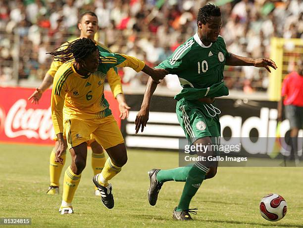 Macbeth Sibaya of South Africa and John Obi Mikel of Nigeria in action during the AFCON and 2010 World Cup Qualifier between Nigeria and South Africa...