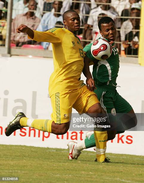 Kagisho Dikgacoi of South Africa and Uche Ikechukwu of Nigeria in action during the AFCON and 2010 World Cup Qualifier between Nigeria and South...