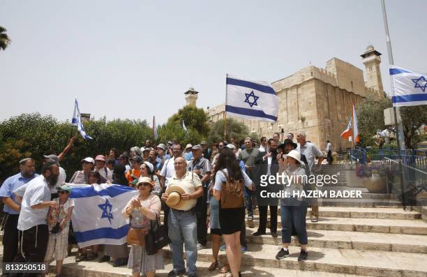 Israelis gather outside the Tomb of the Patriarchs, also known as the Ibrahimi Mosque, which is a holy shrine for Jews and Muslims, in the divided...