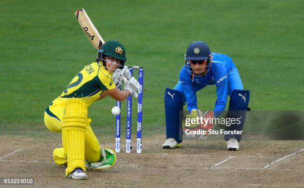 India wicketkeeper Sushma Verma looks on as Australia batsman Nicole Bolton hits out during the ICC Women's World Cup 2017 match between Australia...