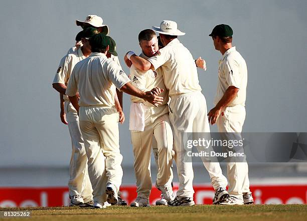 Stuart MacGill of Australia is congratulated by teammates afte dismissing Ramnaresh Sarwan of West Indies during day three of the Second Test match...