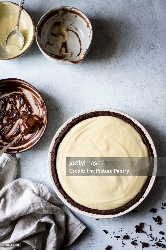 A chocolate pie base filled with melted milk and white chocolate