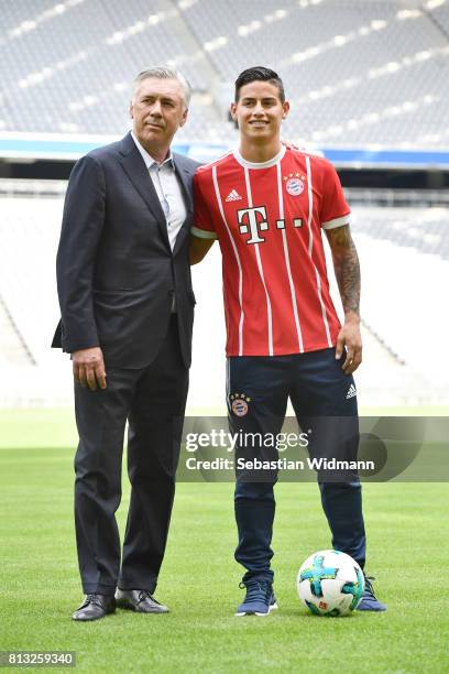 Head coach Carlo Ancelotti and James Rodriguez pose for a picture on the pitch of the Allianz Arena on July 12, 2017 in Munich, Germany.