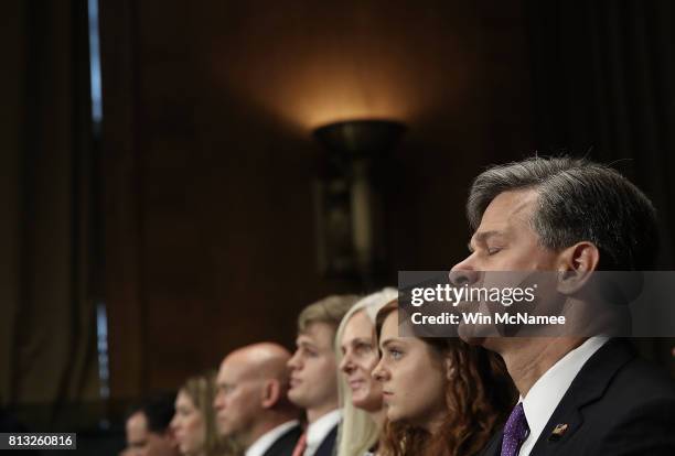 Director nominee Christopher Wray listens to opening statements by senators during his confirmation hearing before the Senate Judiciary Committee...