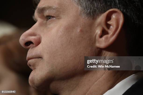 Director nominee Christopher Wray listens to opening statements by senators during his confirmation hearing before the Senate Judiciary Committee...