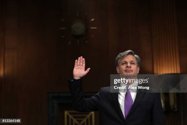 Director nominee Christopher Wray is sworn in during his confirmation hearing before the Senate Judiciary Committee July 12, 2017 on Capitol Hill in...