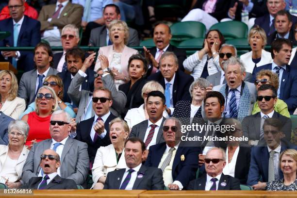 Sir Ian McKellen, Dame Maggie Smith, Sir Chris Hoy, Hideki Matsuyama and the Duke of Kent react in the centre court royal box during the Gentlemen's...