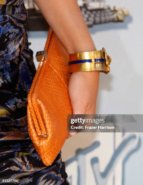 Detail view of actress Emma Stone's handbag and jewelry is seen as she arrives at the 17th annual MTV Movie Awards held at the Gibson Amphitheatre on...