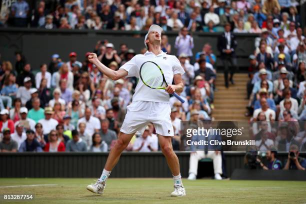 Sam Querrey of The United States celebrates match point and victory during the Gentlemen's Singles quarter final match against Andy Murray of Great...