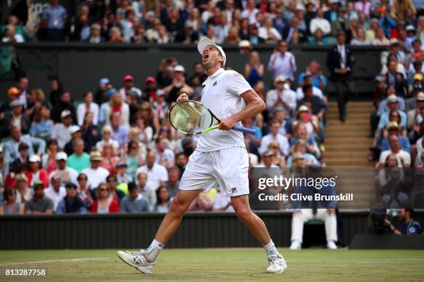 Sam Querrey of The United States celebrates match point and victory during the Gentlemen's Singles quarter final match against Andy Murray of Great...