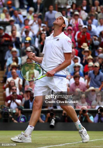 Sam Querrey of The United States celebrates match point and victory during the Gentlemen's Singles quarter final match against Andy Murray of Great...