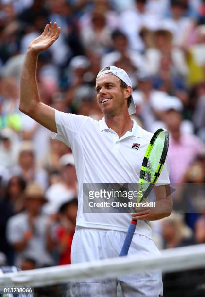 Sam Querrey of The United States acknowledges the crowd as he celebrates victory after the Gentlemen's Singles quarter final match against Andy...