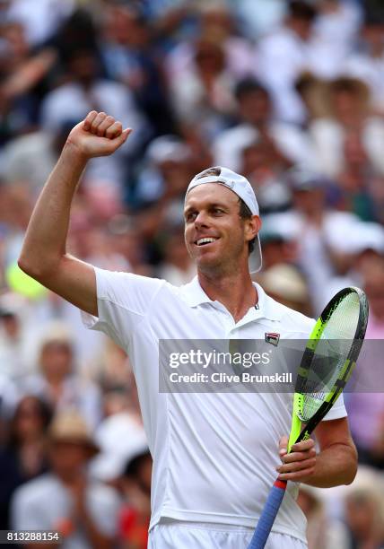 Sam Querrey of The United States celebrates victory after the Gentlemen's Singles quarter final match against Andy Murray of Great Britain on day...