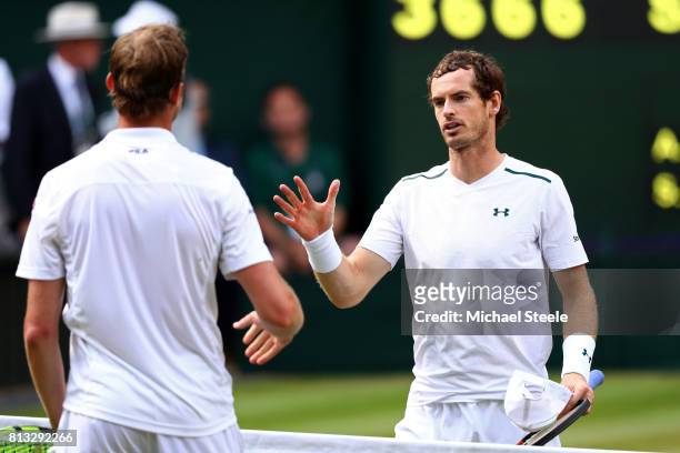 Andy Murray of Great Britain and Sam Querrey of The United States shake hands after the Gentlemen's Singles quarter final match on day nine of the...