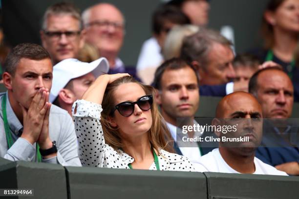 Andy Murray's wife Kim looks despondent alongside physio Shaun Annun during his Gentlemen's Singles quarter final match against Sam Querrey of The...
