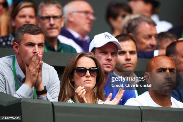 Andy Murray's wife Kim applauds during his Gentlemen's Singles quarter final match against Sam Querrey of The United States on day nine of the...