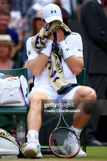 Andy Murray of Great Britain reacts as he takes a break during the Gentlemen's Singles quarter final match against Sam Querrey of The United States...