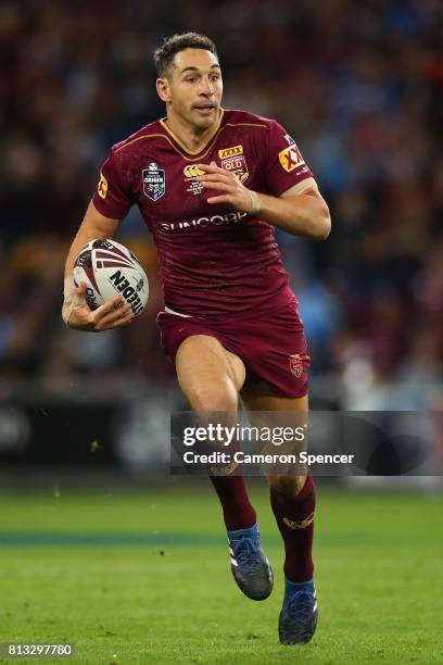 Billy Slater of the Maroons runs the ball during game three of the State Of Origin series between the Queensland Maroons and the New South Wales...