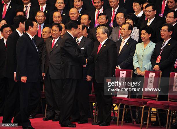Jia Qingling , chairman of the Chinese People's Political Consultative Conference of the Chinese Communist Party, greets Taiwan businessman Ting...