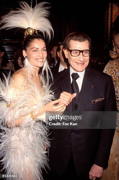 Laetitia Casta and Yves Saint Laurent attend the Miro Exhibition at the Pompidou Center Museum on January 15, 2000 in Paris France.