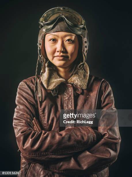 vintage styled woman pilot - flying goggles stock pictures, royalty-free photos & images