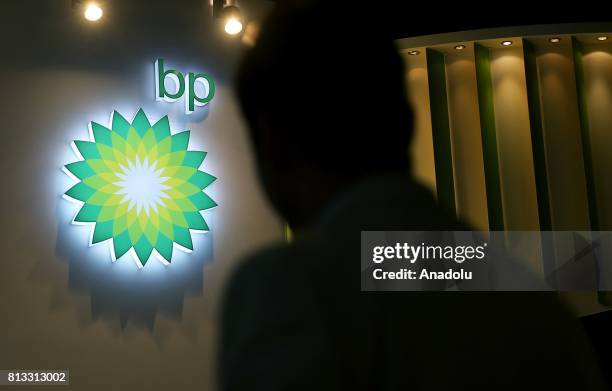 Silhouette of a man is seen in front of "British Petroleum" logo during the 22nd World Petroleum Congress at Lutfi Kirdar International Convention...