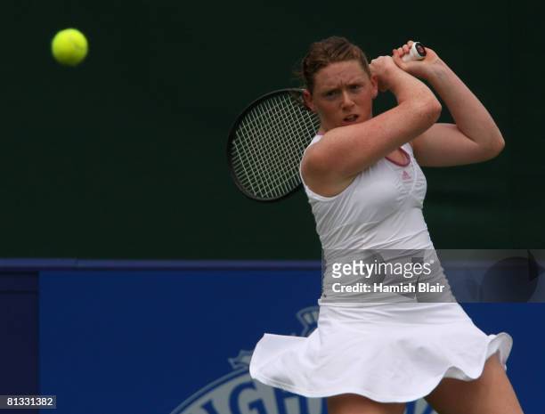 Naomi Cavaday of Great Britain plays a backhand during her match against Marina Erakovic of New Zealand during day one of the Surbiton Trophy at The...
