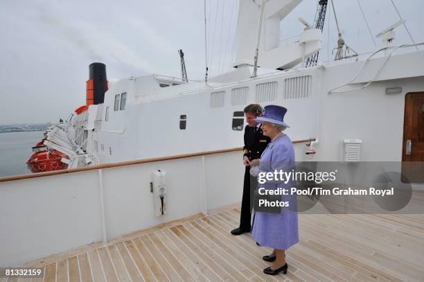 Queen Elizabeth II visits the QE2 ocean liner in Southampton dock on June 2, 2008 in Southampton, England.