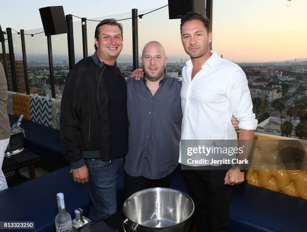 Andrew Lustgarten of Madison Square Garden Company poses with Tao Group Co-Founders Noah Tepperberg and Jason Strauss attend The Grand Opening Of The...