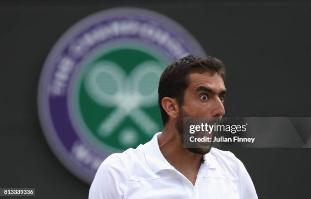 Marin Cilic of Croatia reacts during the Gentlemen's Singles quarter final match against Gilles Muller of Luxembourg on day nine of the Wimbledon...