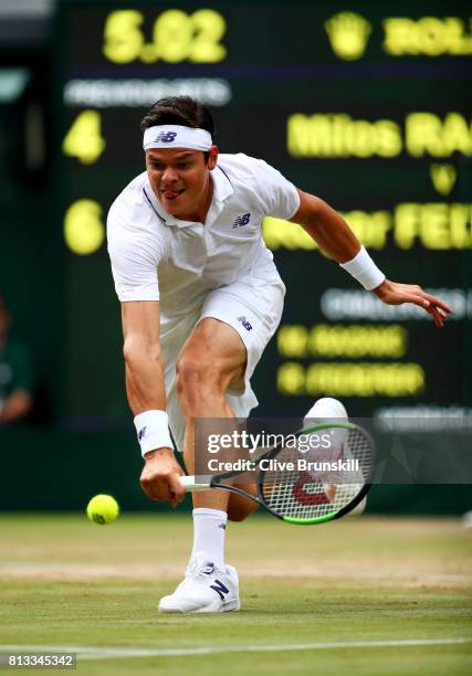Milos Raonic of Canada plays a backhand during the Gentlemen's Singles quarter final match against Roger Federer of Switzerland on day nine of the...