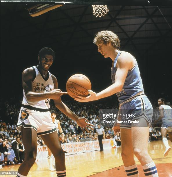 College Basketball: NCAA Final Four, Indiana State Larry Bird handing ball to Michigan State Magic Johnson during championship game, Salt Lake City,...