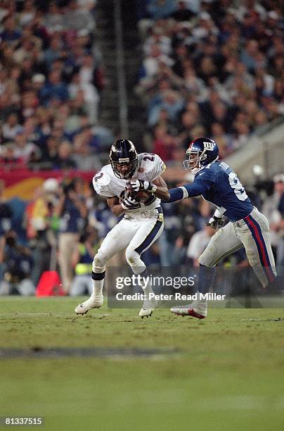 Football: Super Bowl XXXV, Baltimore Ravens Duane Starks in action, making interception and scoring TD vs New York Giants, Tampa, FL 1/28/2001