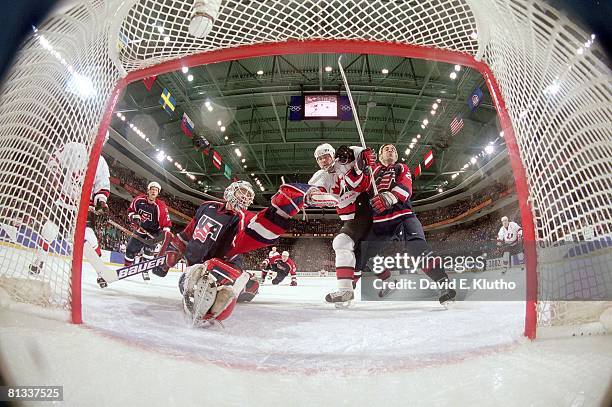 Hockey: 2002 Winter Olympics, USA goalie Mike Richter in action, making 2nd period save during gold medal game, USA Chris Chelios vs Canada Owen...