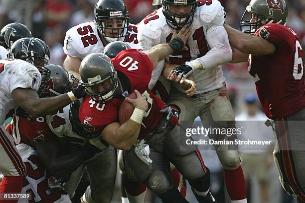 Football: Tampa Bay Buccaneers Mike Alstott in action during pileup tackle vs Atlanta Falcons, Tampa, FL 12/8/2002