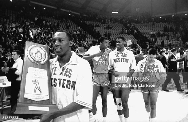 College Basketball: NCAA Final Four, Texas Western players victorious with National Championship trophy after winning game vs Kentucky, College Park,...