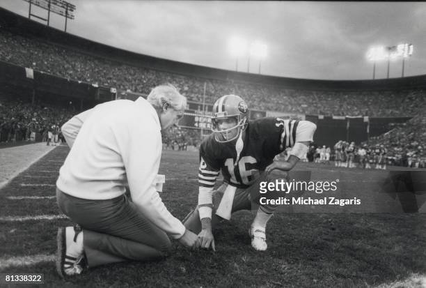 Football: NFC Playoffs, San Francisco 49ers coach Bill Walsh with QB Joe Montana during game vs Chicago Bears, San Francisco, CA 1/6/1985