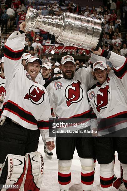 Hockey: NHL Finals, New Jersey Devils goalie Martin Brodeur , Ken Daneyko , and Patrik Elias victorious with trophy after winning game vs Anaheim...