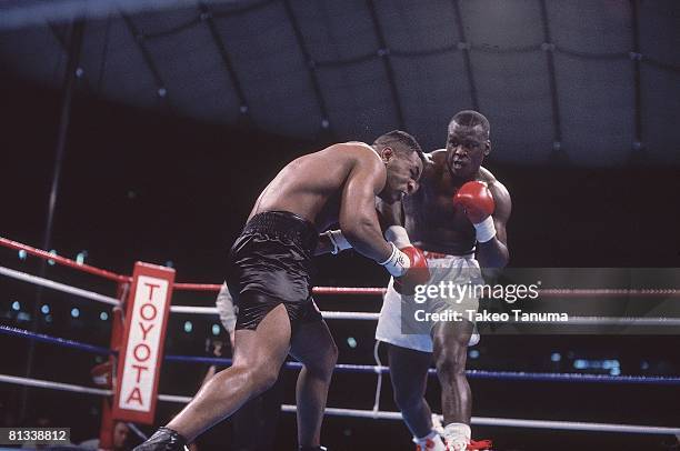 Boxing: WBC/WBA/IBF Heavyweight Title, James Buster Douglas in action, throwing punch vs Mike Tyson at Tokyo Dome, Tokyo, Japan 2/11/1990