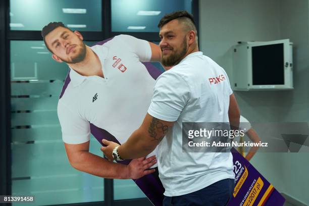 Athlete Konrad Bukowiecki from Poland smiles and carries his poster while the press conference one day before European Athletics U23 Championships...