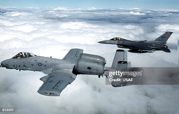 An A-10 Thunderbolt II, and F-16 Fighting Falcon from the 52nd Fighter Wing, Spangdahlem Air Base, Germany, fly in formation over southern Germany,...